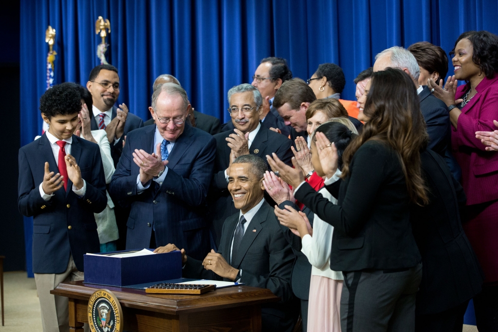President Barack Obama signs S. 1177, Every Student Succeeds Act (ESSA), during a bill a signing ceremony in the Eisenhower Executive Office Building South Court Auditorium, Dec. 10, 2015. (Official White House Photo by Amanda Lucidon)